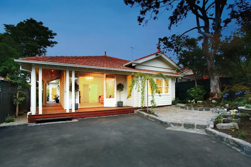 Retreat Road Residence — single-storey home with a front verandah, red roof and landscaped driveway