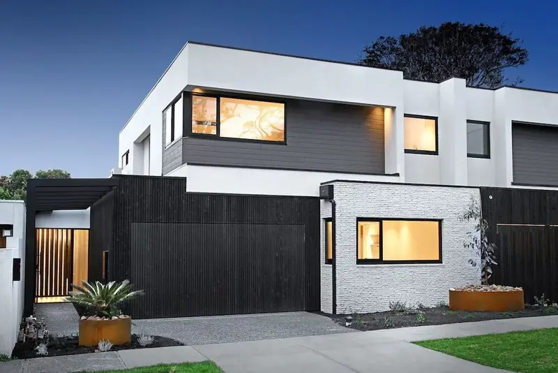 85 Iona Project — contemporary two-storey corner home with contrasting white and dark cladding
